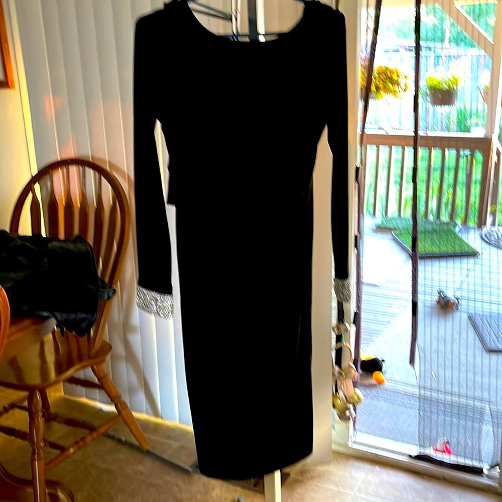 Size 4 Marina Black dress round front neckline with low back   Sexy